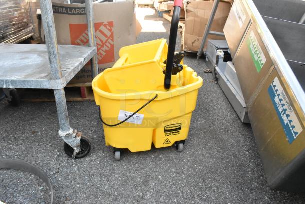 Rubbermaid yellow poly mop bucket with wringing attachment, features WaveBrake technology, in good condition with visible logo.
