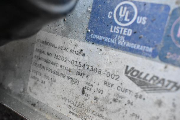 Vollrath model FC-4C-02120-N label with specifications, including volts, amps, and refrigerant type, on stainless steel surface.
