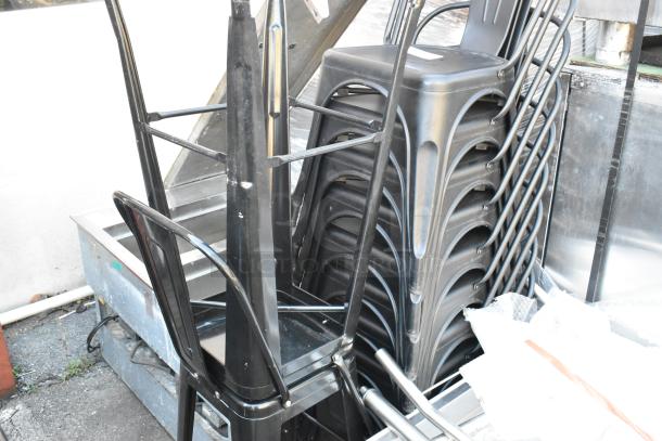 12 black metal Tolix style bar stools and dining chair in stack, good condition, industrial design.