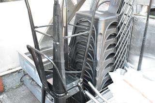 12 black metal Tolix style bar stools and dining chair in stack, good condition, industrial design.