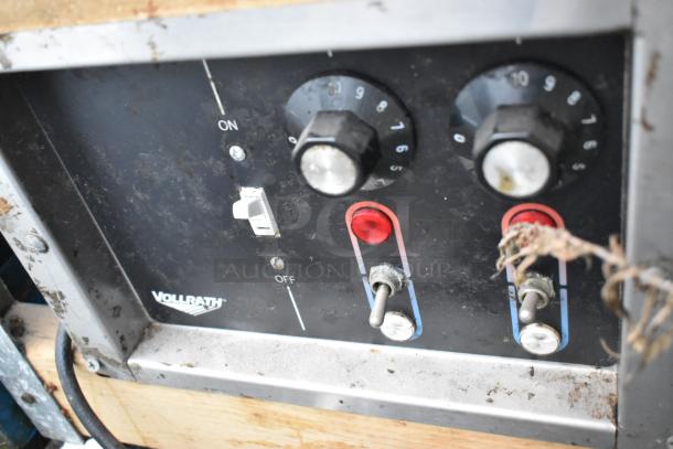 Vollrath Stainless Steel 2 Well Drop In control panel, featuring dual knobs for temperature, toggle switches, and on/off indicator.