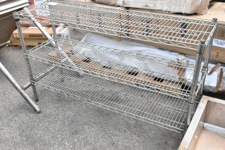 Chrome finish 3-tier wire shelving unit, in good condition, features adjustable shelves, ideal for storage solutions.