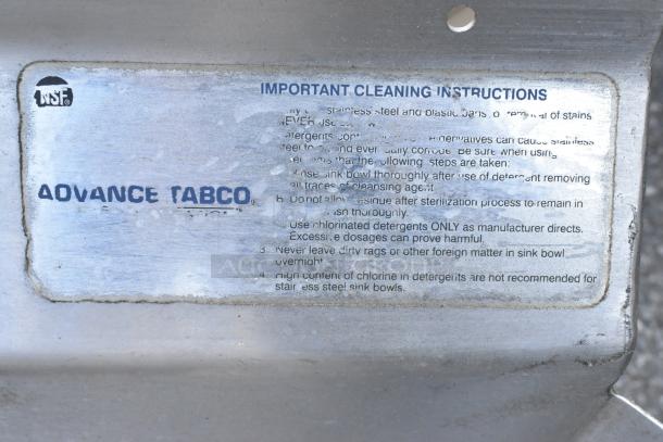 Alt text: Stainless steel three-bay sink with left-side dirty dish table. Advance Tabco logo and cleaning instructions visible.