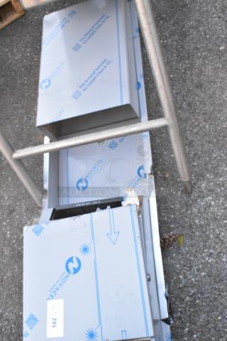 Stainless steel wall mount paper towel dispenser and trash can, new with protective film. Label "182" visible.