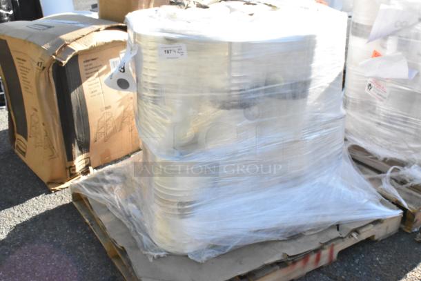 Pallet of brand new Clark PERF Printed RS 420mm Dry Ice, shrink-wrapped. Box shows minor dents. Tag reads: "187 kg".