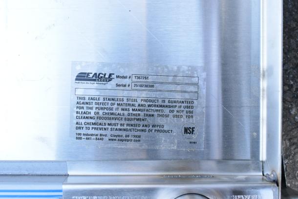 Eagle Group T3672SE stainless steel work table label showing model, serial number, and care instructions.