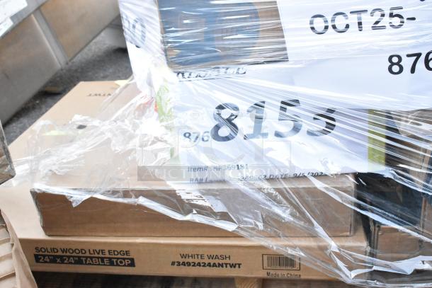 A pallet with boxed items including a 24" x 24" solid wood live edge tabletop in white wash. Items are wrapped in plastic indicating new, scratch and dent condition.