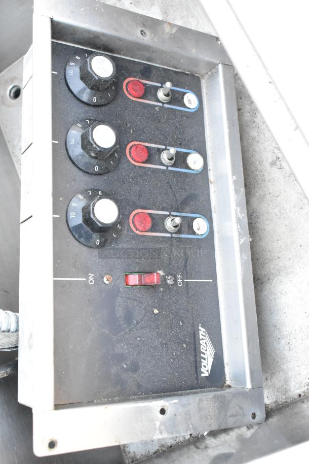 Stainless steel commercial 3 bay drop-in steam table controls, featuring temperature dials and toggles, Vollrath brand.