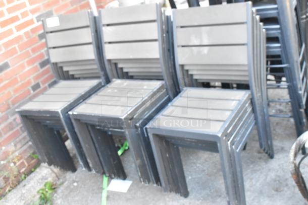 17 stackable patio chairs, dining height, gray metal with slatted seat and back, suitable for outdoor use. Auction: 17 times bid.