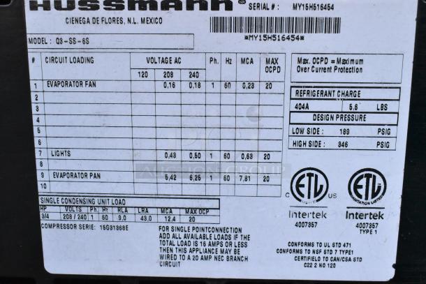 Hussmann Q3-SS-6S metal commercial merchandiser label showing voltage, phase details, and certification stamps.