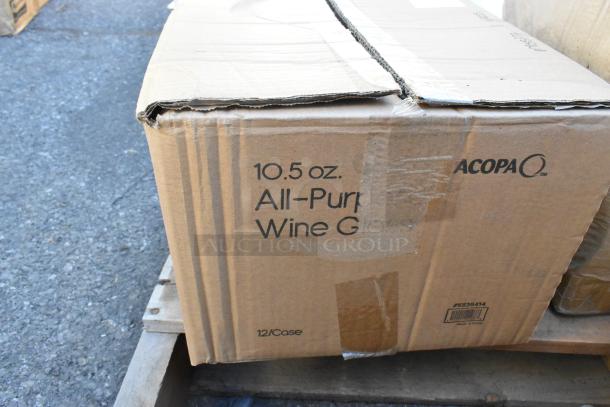 Cardboard box labeled "10.5 oz. All-Purpose Wine Glasses" by Acopa. Box is slightly damaged. Contains 12 glasses per case.