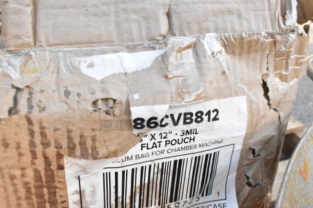 Damaged cardboard box labeled "86CVB812" containing 3mil flat pouches for chamber machine.