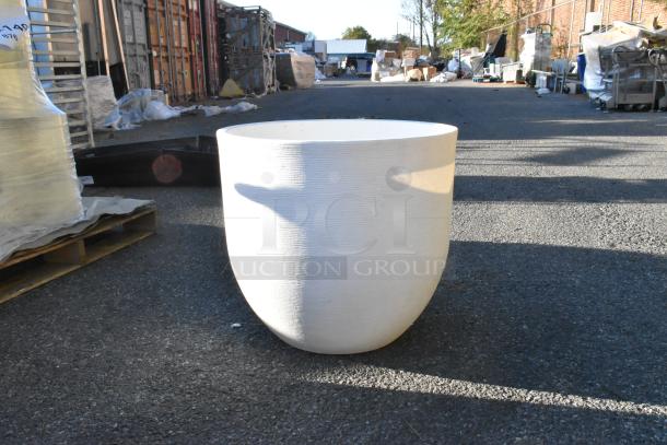 White round planter on asphalt, textured surface, excellent condition, no visible markings, suitable for large plants.