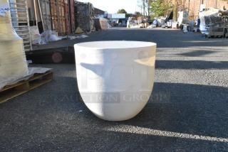 White round planter on asphalt, textured surface, excellent condition, no visible markings, suitable for large plants.