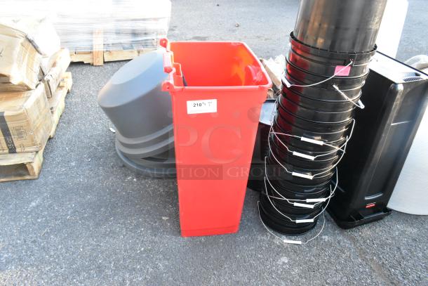 Red poly trash can, rectangular, sturdy construction, in good condition, with a white label marked "210."