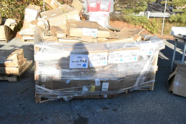 Pallet of 7 scratch and dent items, including floor mat, trash can lid, and flatware rack, wrapped in plastic with labels showing PCI codes.