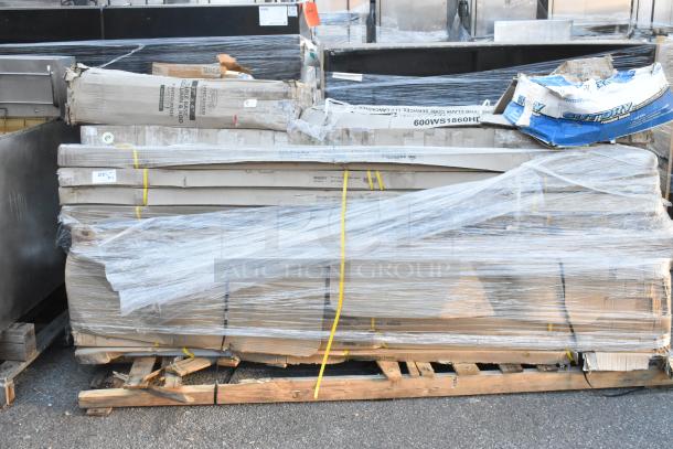 Bundle of 15 scratch and dent items including Regency tables, wrapped on pallets, various packaging visible.