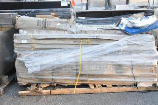 Bundle of 15 scratch and dent items including Regency tables, wrapped on pallets, various packaging visible.