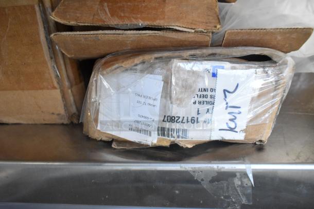 Table lot of 12 new GM items including GM22936585 cargo area security enclosure, GM23256564 roof rail, GM23499.99 grille.