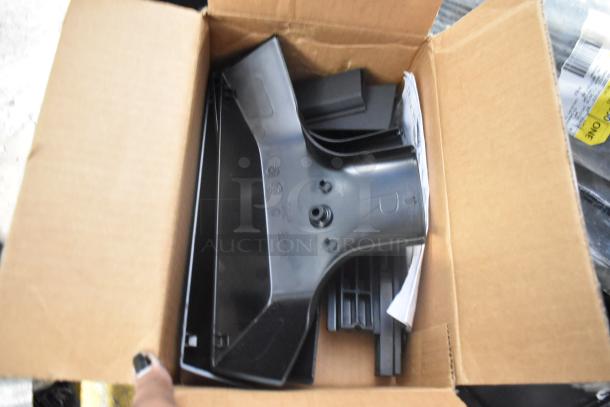 Brand new car parts in box, includes black car mats and various components in a labeled poly bin, excellent condition.