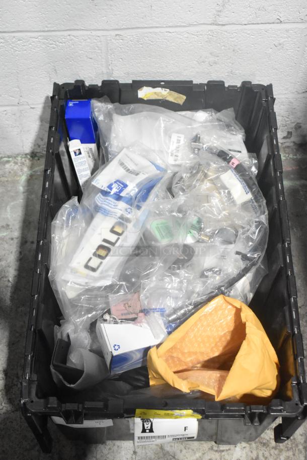 Lot of new car parts in a black poly bin, including GM Chevy Camaro front driver side marker lamp (92246245).