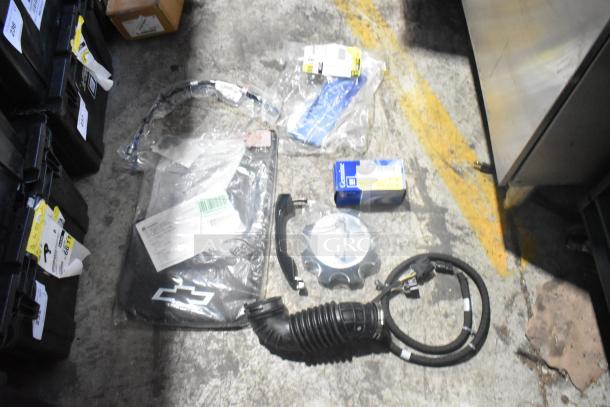 Lot of new car parts, including GM Chevy Camaro front driver side marker lamp (92246245), in black poly bin.