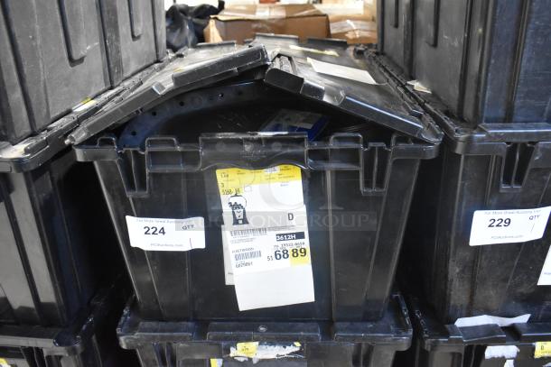Brand new car parts in black poly bin, featuring various panels. Labels indicate shipping details and lot number 224.