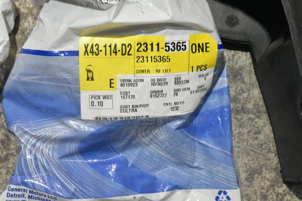 "Brand new car part packaging with label X43-114-D2, part number 2311-5365, in poly bin, General Motors LLC."