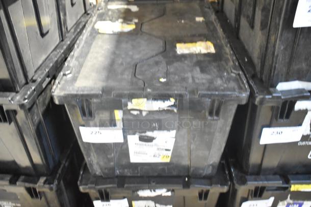 New lot of car parts, including Corvette bags, in black poly bin. Bin with labels and moderate wear visible.