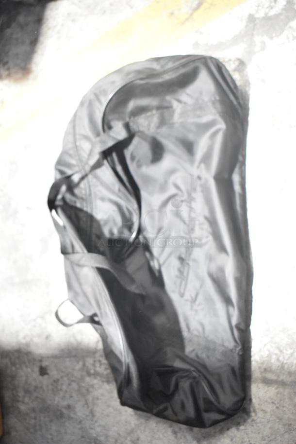 Brand new Corvette bag in black, part of a lot of car parts, in a black poly bin.