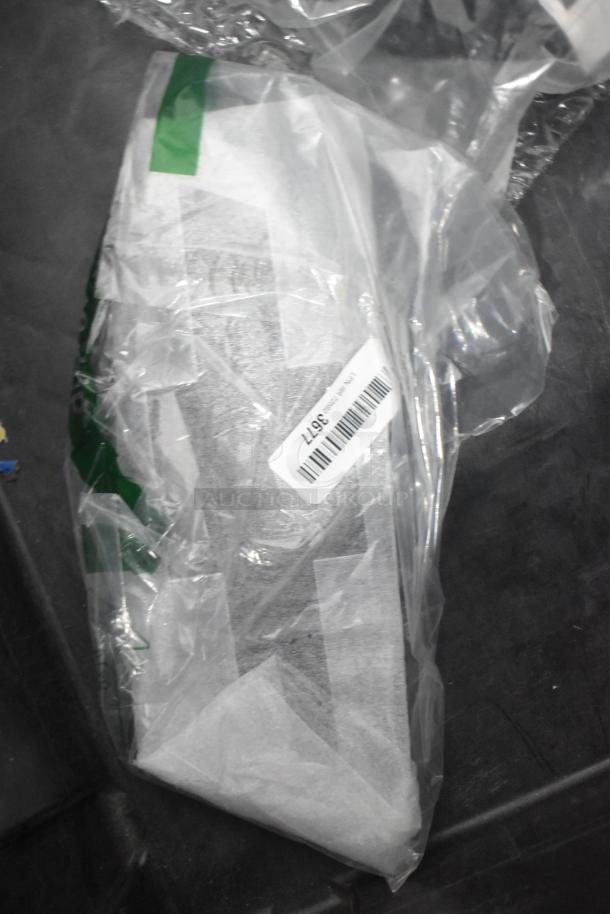 Alt text: Black poly bin containing a brand new lot of various car parts, including Corvette bags. Visible barcode label reads "56771."