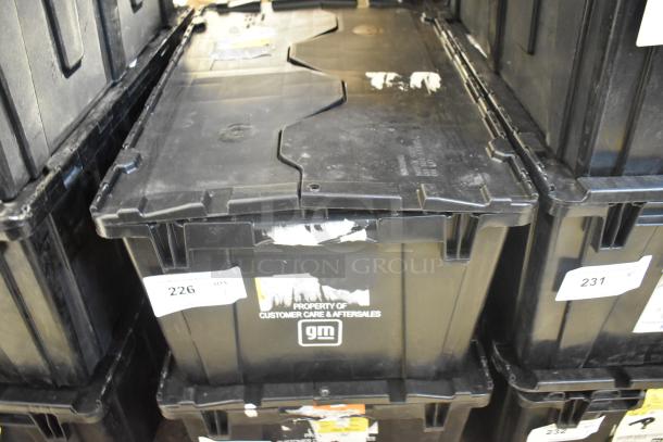 Brand new GM car parts lot in black poly bin, including ENS Filet and ACDelco Brake Air Duct. GM label visible.