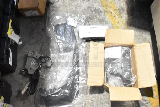 Lot of new car parts in black poly bin, including GM 84221510 ENS Filet and GM 25790357 ACDelco Brake Air Duct.