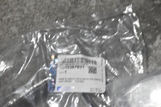 Brand new car parts lot with GM 84221510 ENS Filet, GM 25790357 ACDelco Brake Air Duct in black poly bin; label shows barcode and part details.