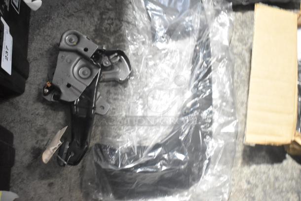 Brand new GM car parts lot, including GM 84221510 ENS Filet, ACDelco 25790357 brake air duct, in black poly bin.