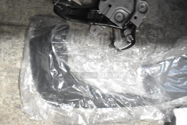 Lot of new car parts, including GM 84221510 ENS Filet, GM 25790357 ACDelco Brake Air Duct in black poly bin, sealed in packaging.