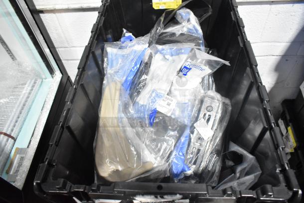 Lot of new GM car parts including GM 84221510 ENS Filet, GM 25790357 ACDelco Brake Air Duct in black poly bin. Visible labels.