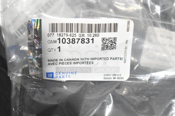 Brand new GM car parts in poly bag; tag shows GM# 10387831, quantity 1, made in Canada with imported parts.