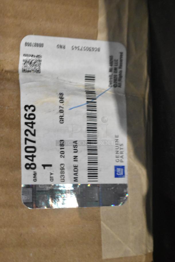 Alt text: "Label on GM genuine parts box; includes barcode and 'Made in USA' marking, part number 84072463."