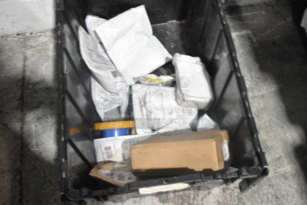 Brand new car parts lot including Hawk Racing disc brake pads and car mats in a black poly bin.