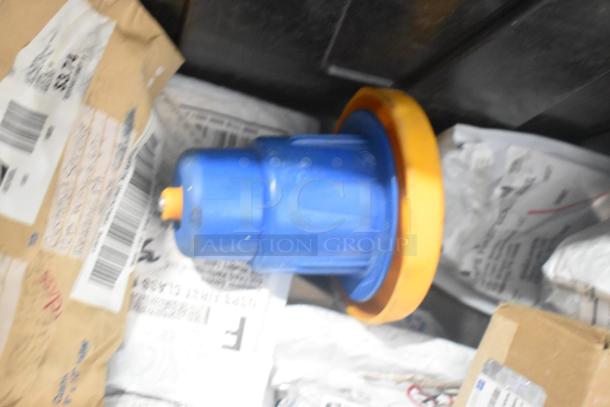 Lot of brand new car parts in a black poly bin, including car mats and Hawk Racing disc brake pads. Tags visible indicate shipping info.