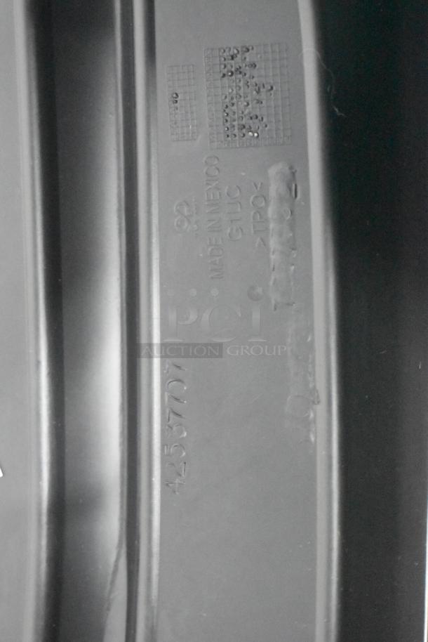 Close-up of a black plastic car part with markings reading "Made in Mexico," code "4253707," and material "TPO."