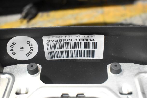 Barcode label on car part reads "GM45R081B004", marked "Made in Mexico", confirming origin and model.