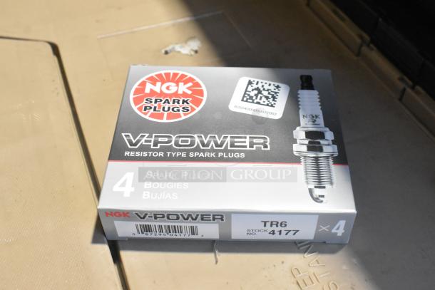 New NGK V-Power spark plugs box, 4-count, in black poly bin, featuring QR code and stock number 4177, model TR6.