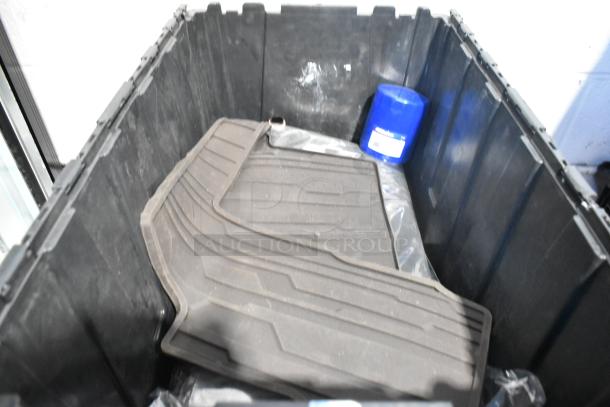 Lot of new car parts in black poly bin, including black car mats and a blue filter. Condition: Brand new.
