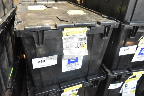 Black poly bin filled with various brand-new car parts, including spark plugs and grille. Labeled "FLEETWOOD," GM tag visible.