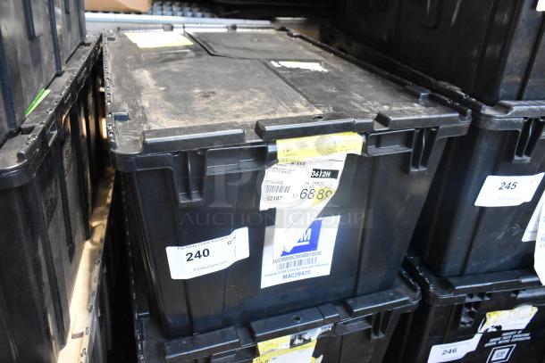 Black poly bin containing new car parts, including GM 19166248 roof luggage carrier cross rail kit; labeled for auction.