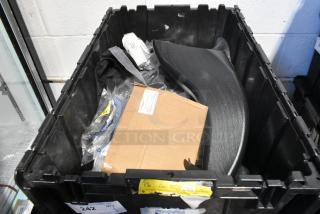 Brand new car parts in a black poly bin, includes Camaro bag. Box and labels visible, indicating contents and information.