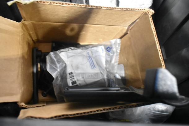 Brand new car parts in open box, including Camaro bag, inside black poly bin. Parts in plastic packaging, pristine condition.