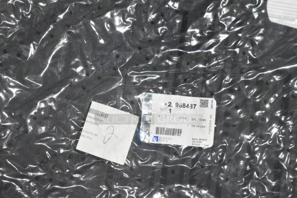 Lot of brand new car parts in black poly bin, visible tag with GM part 22968487, grille item, made in USA.